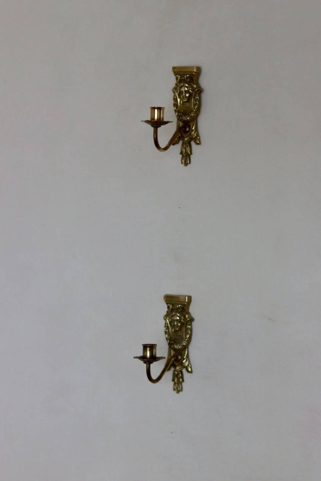Pair of mid-century Swedish brass face motif sconces