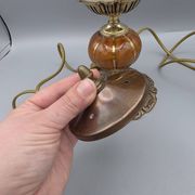 Hollywood Regency bedside lamp in gold metal with a glass globe.