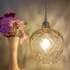 Suspension globe vintage en verre ambré