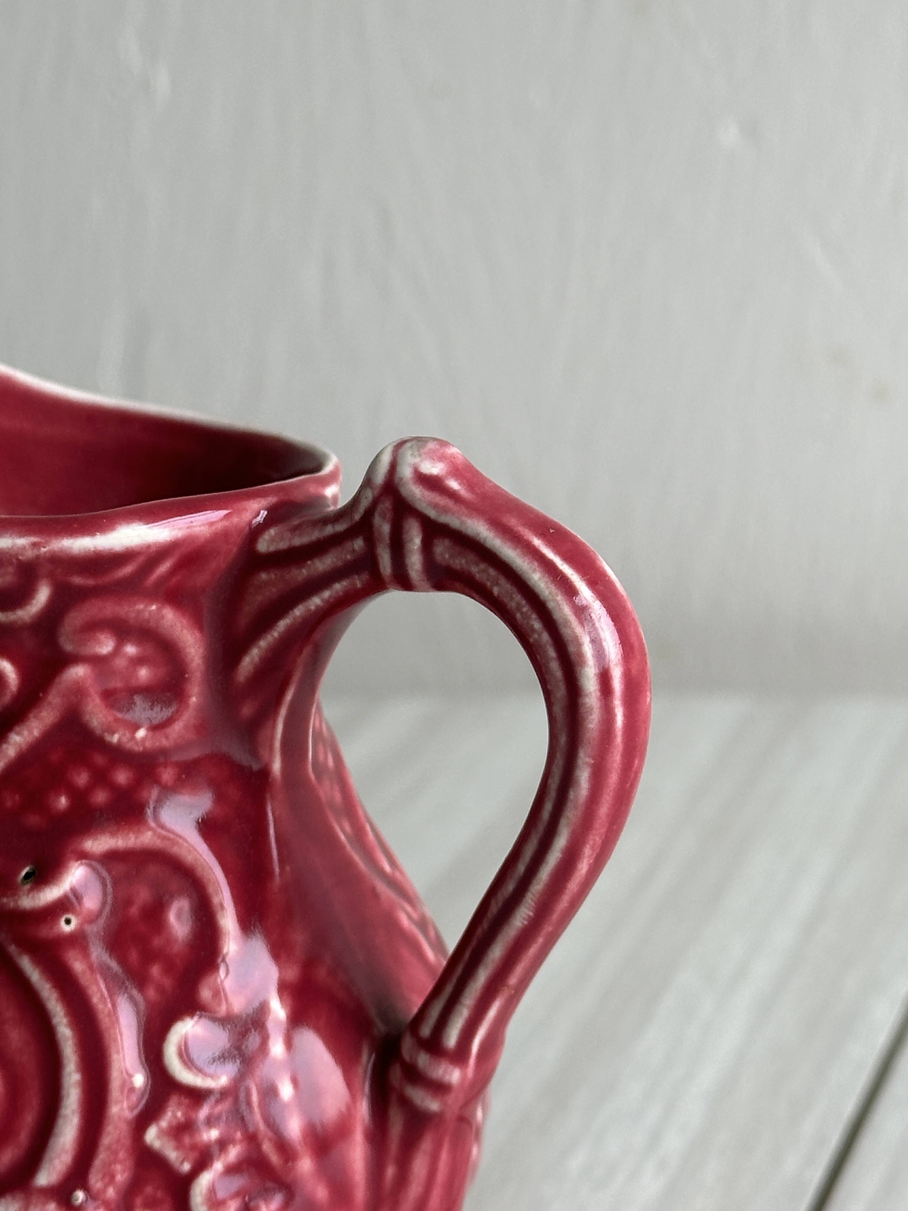 Red ceramic milk jug