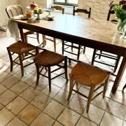 Campaign stool in rattan and wood