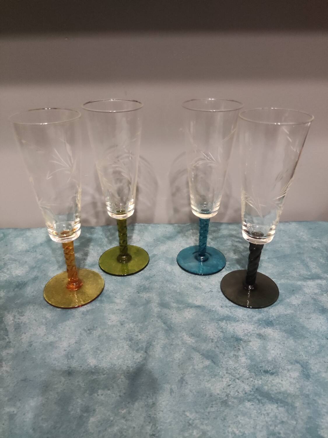 Four vintage stemmed glasses