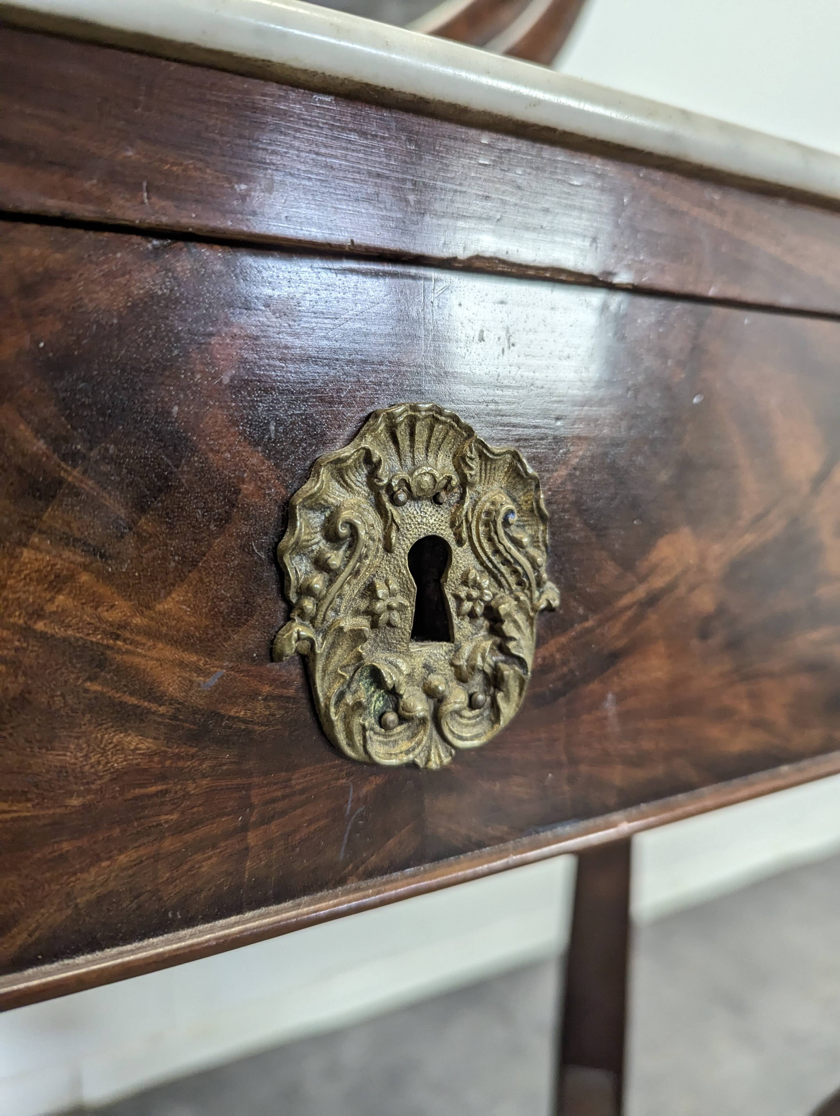 Restoration period flamed mahogany swan neck dressing table