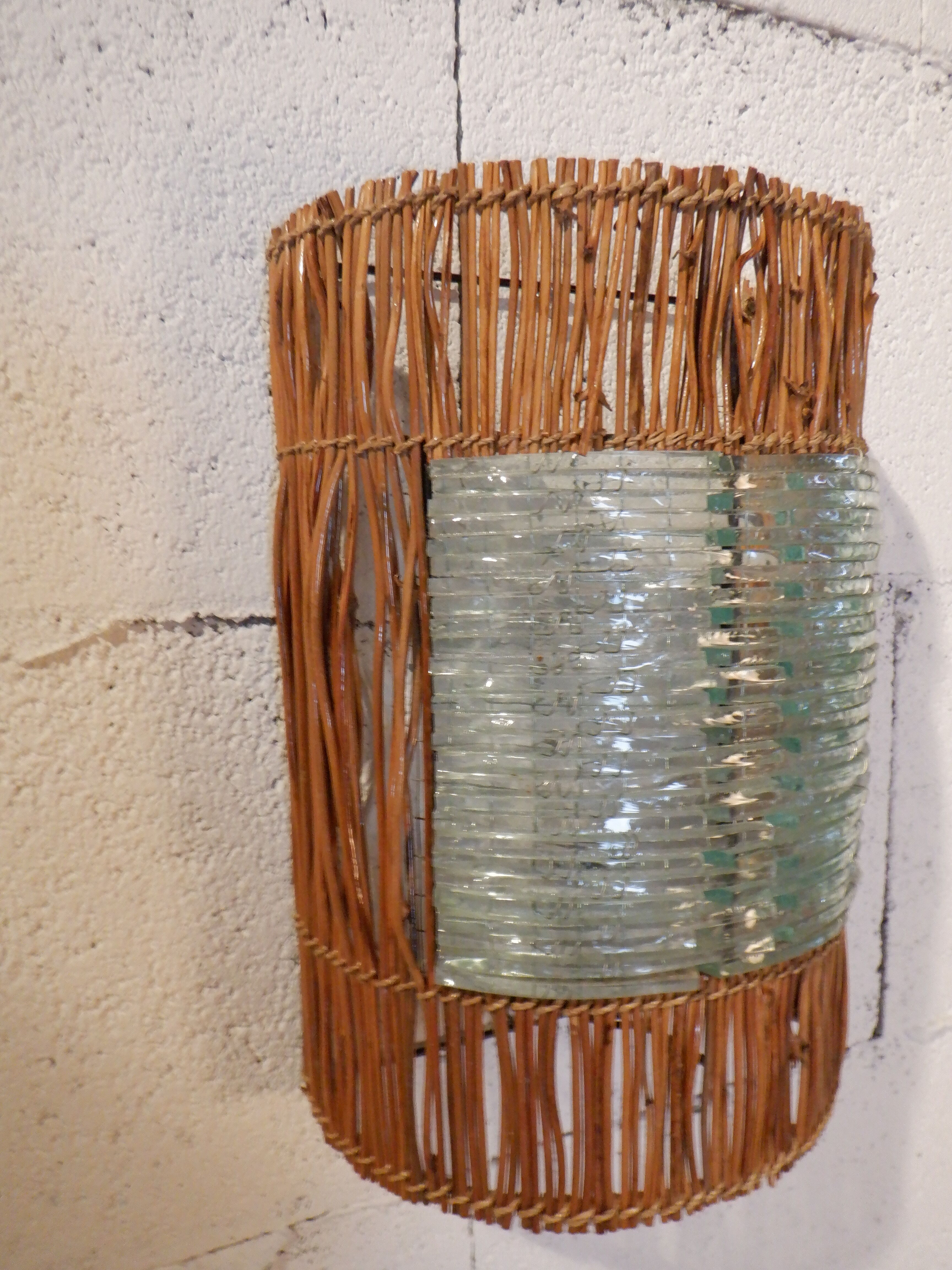 Glass and rattan sconce