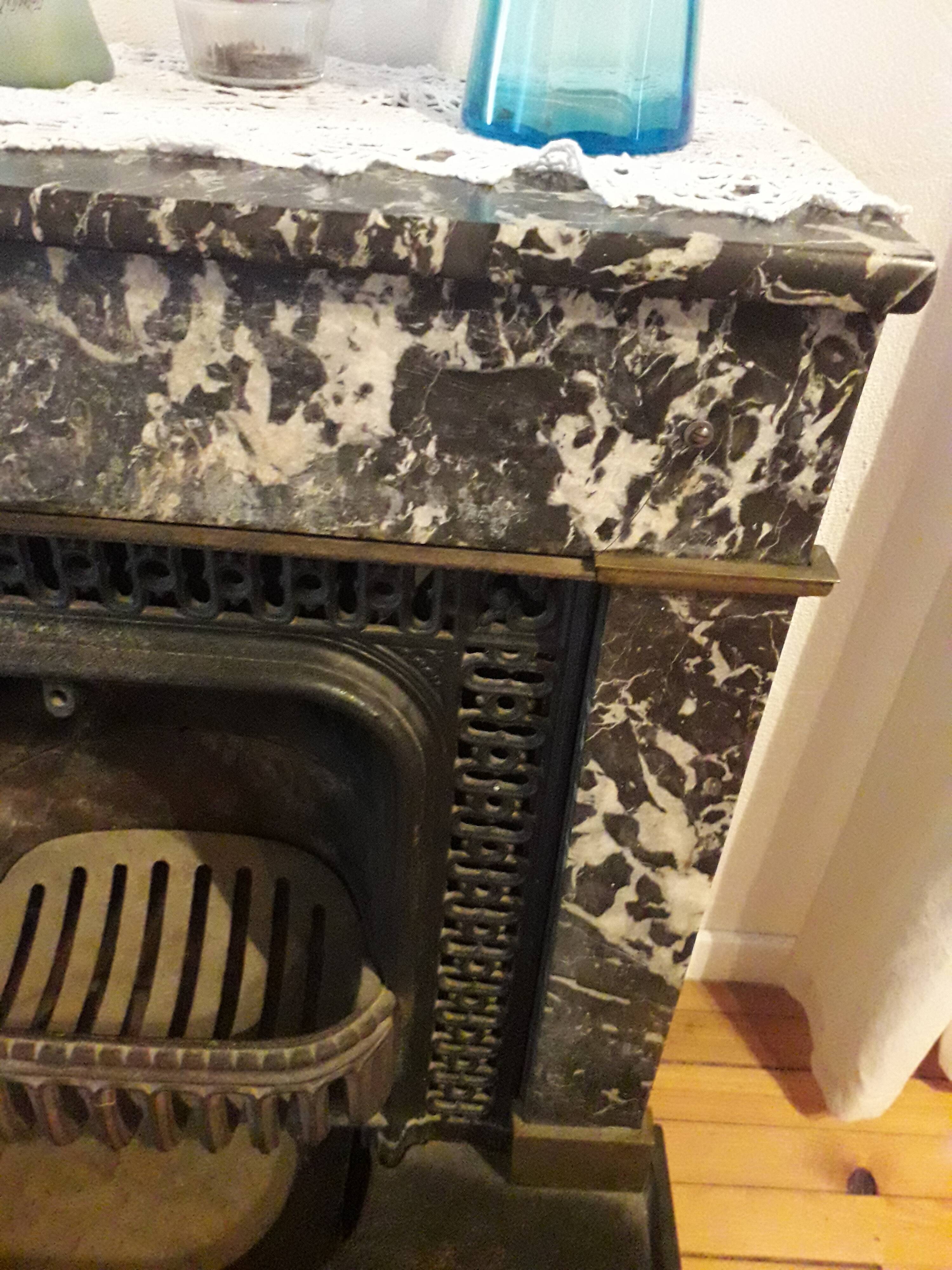 Old black marble fireplace