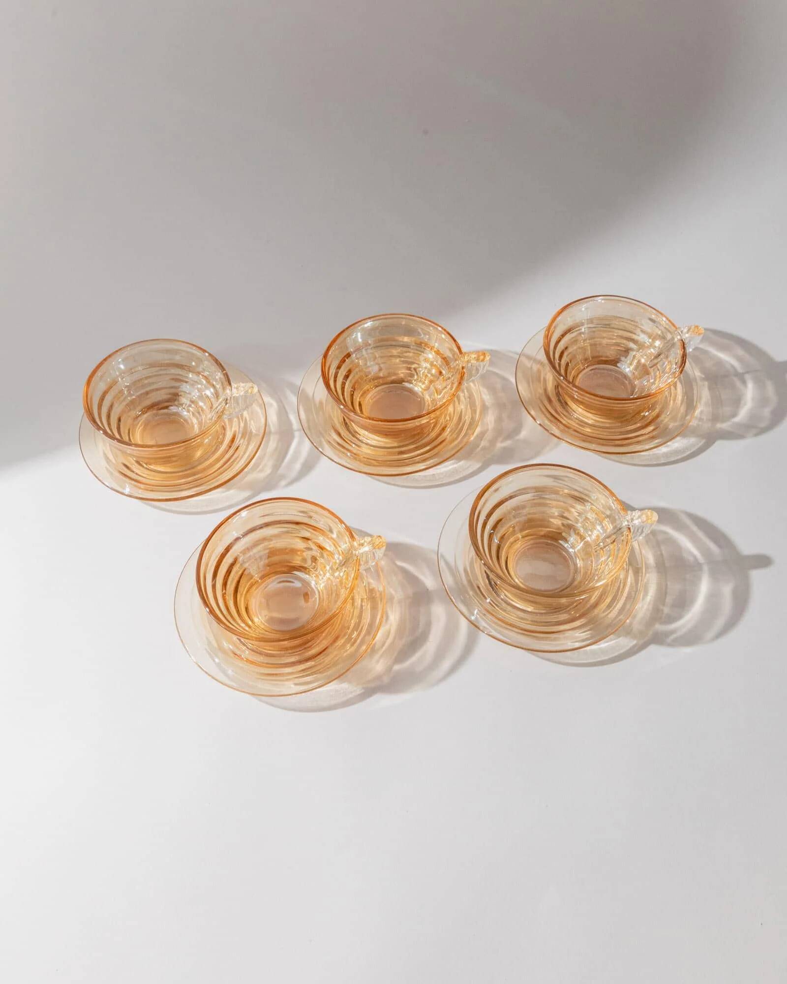 Vintage 1950s glass coffee cups, set of 5, iridescent peach ribbed glass with saucers, Italian design Gondolo.