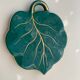 Grained in the shape of vintage dark green enamelled ceramic sheet