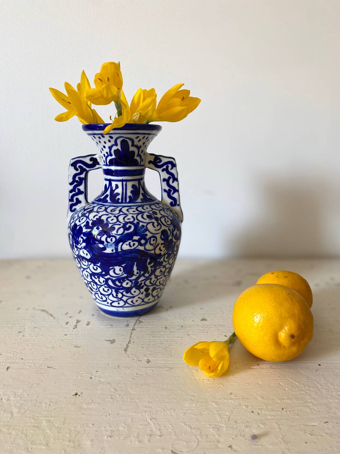 Small amphora vase in old hand-painted ceramic