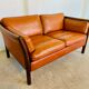 Canapé vintage danois des années 60 en cuir cognac pour 2 personnes.