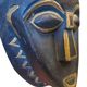 Masque africain en bois sculpté bleu et doré, oreilles de lion