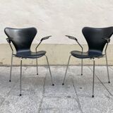 Pair of Arne Jacobsen series 7 chairs in black leather
