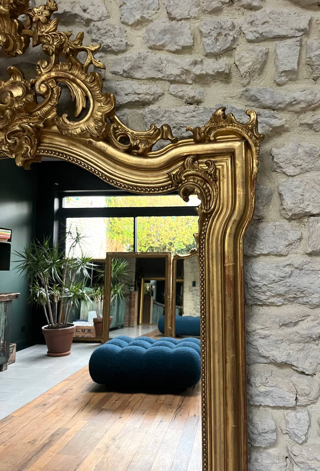 Antique mirror 169/105cm with pediments and pearl detailing in gold leaf.