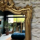 Antique mirror 169/105cm with pediments and pearl detailing in gold leaf.