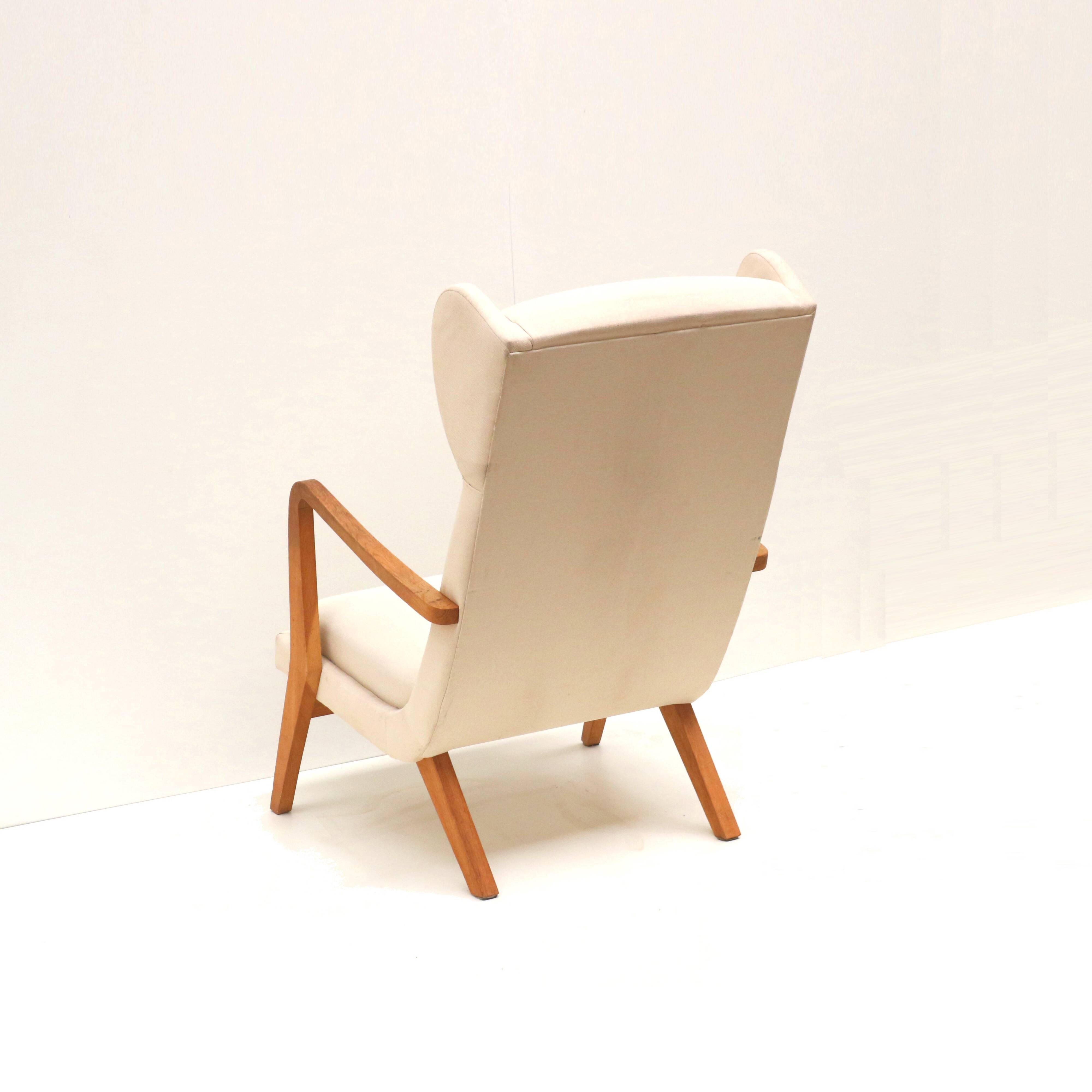 Danish design vintage armchair with cream upholstery from the 70s