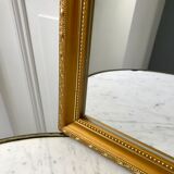 Miroir allongé en stuc doré années 60-70