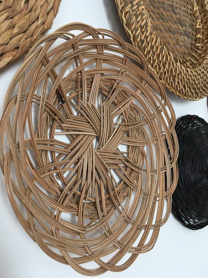 Wall composition of seven baskets and wicker trays