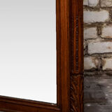 Beveled mirror in carved oak early twentieth century