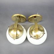 Pair of Art Deco wall sconces in brass and opaline glass, Europe, 1930s