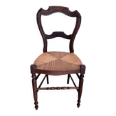 Antique wooden chairs with rush seating.