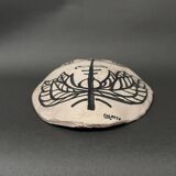 Africanist mask in glazed white terracotta, face signed Colette.