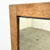 Antique mirror on an elm wardrobe door