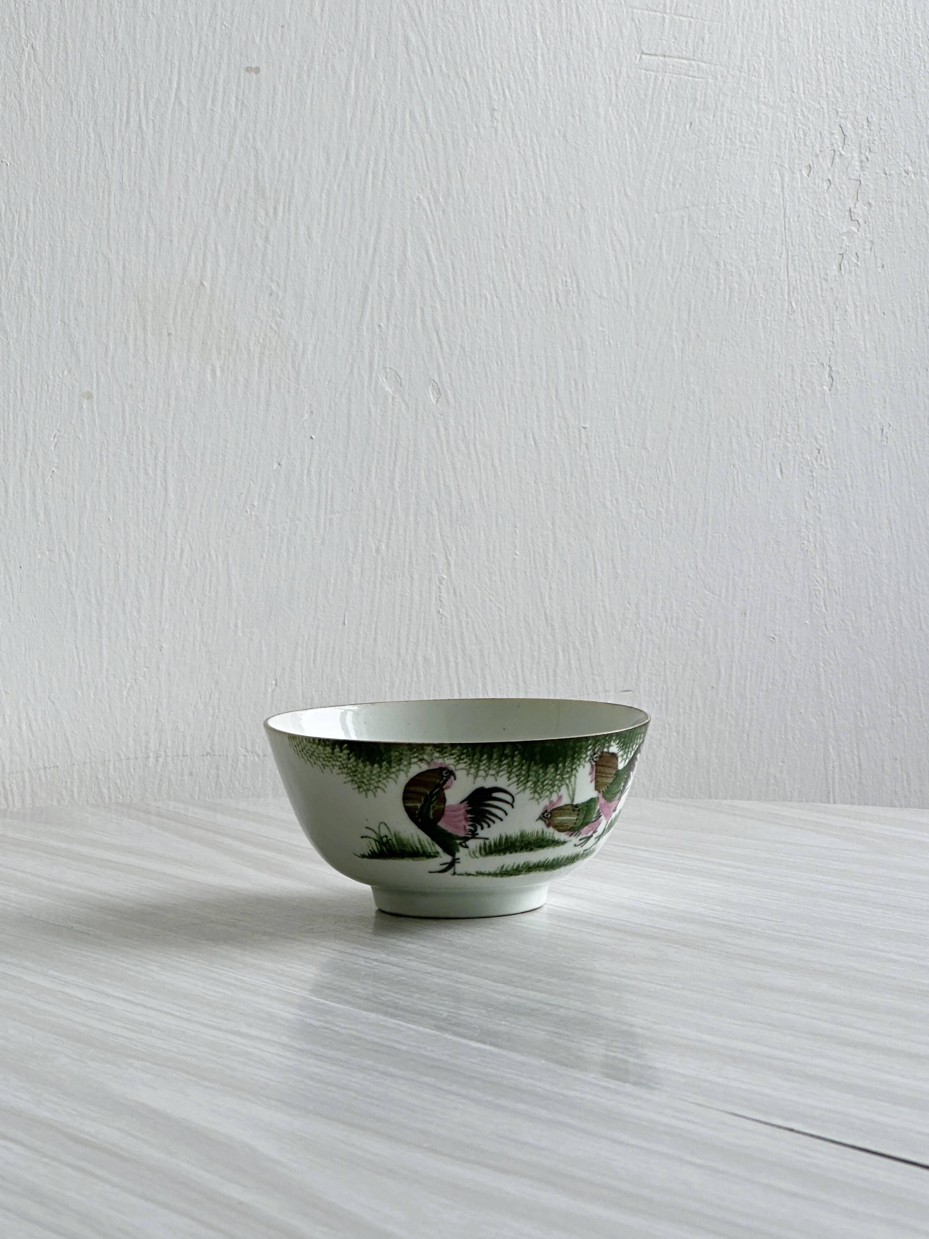 Antique porcelain bowl with rooster motif