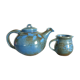 Vernified and flamed sandstone teapot, and its milk pot