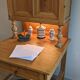 Former campaign secretary's desk in solid pine with a high cupboard.