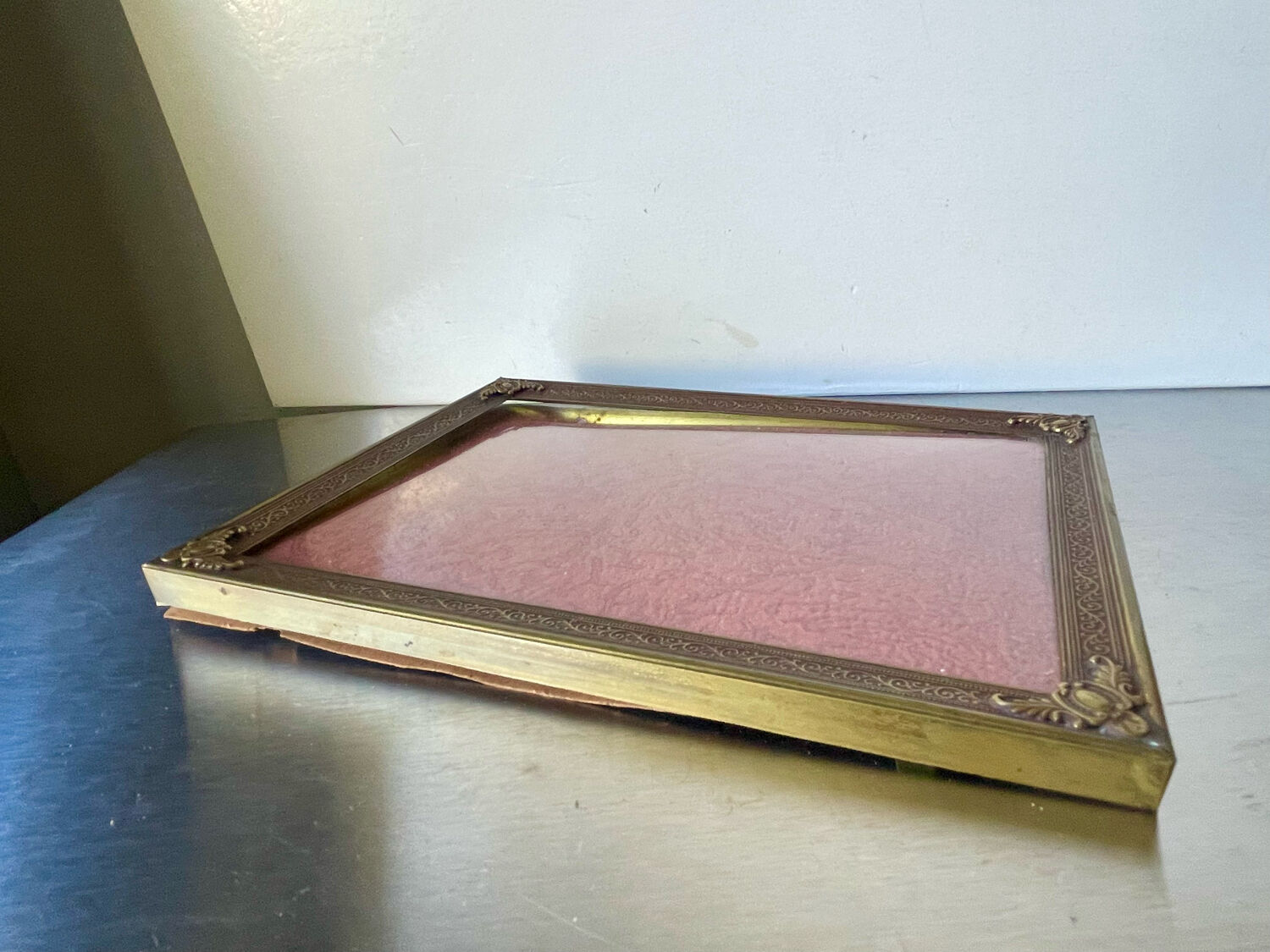 Metal frame in gold colored brass