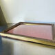 Metal frame in gold colored brass
