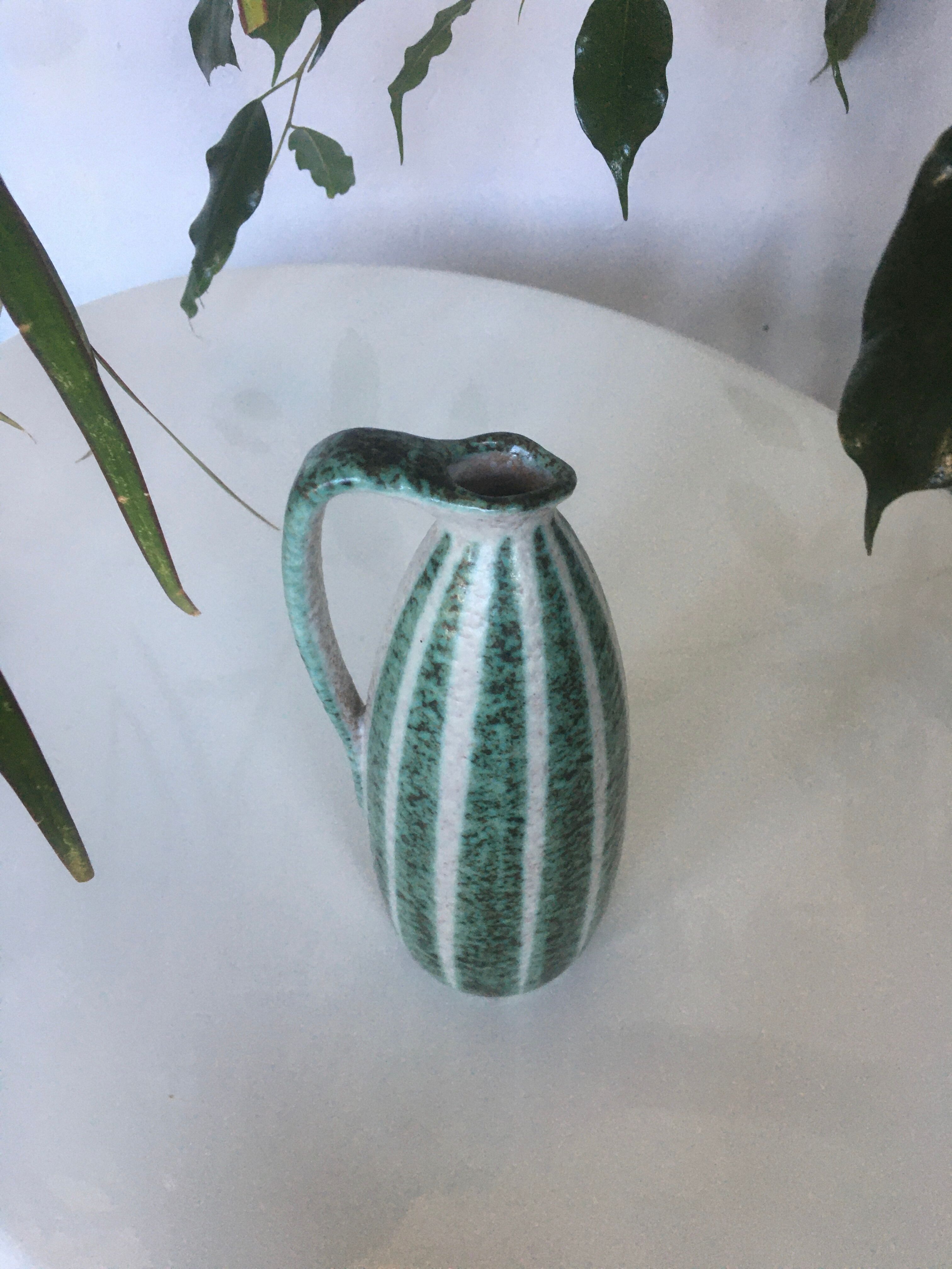 Signed and numbered art ceramics pitcher