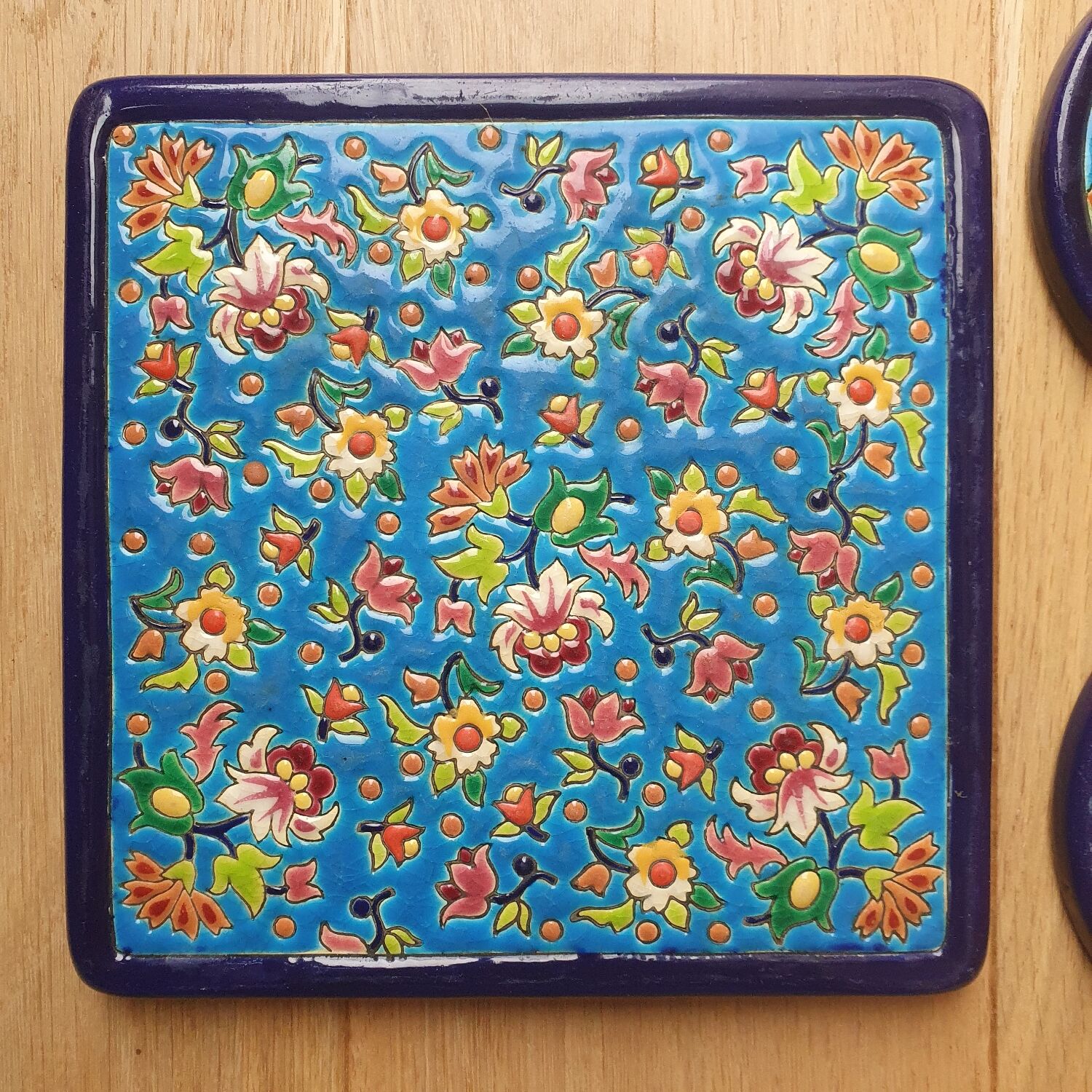 Trivet and Longwy enamel bottle