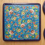 Trivet and Longwy enamel bottle