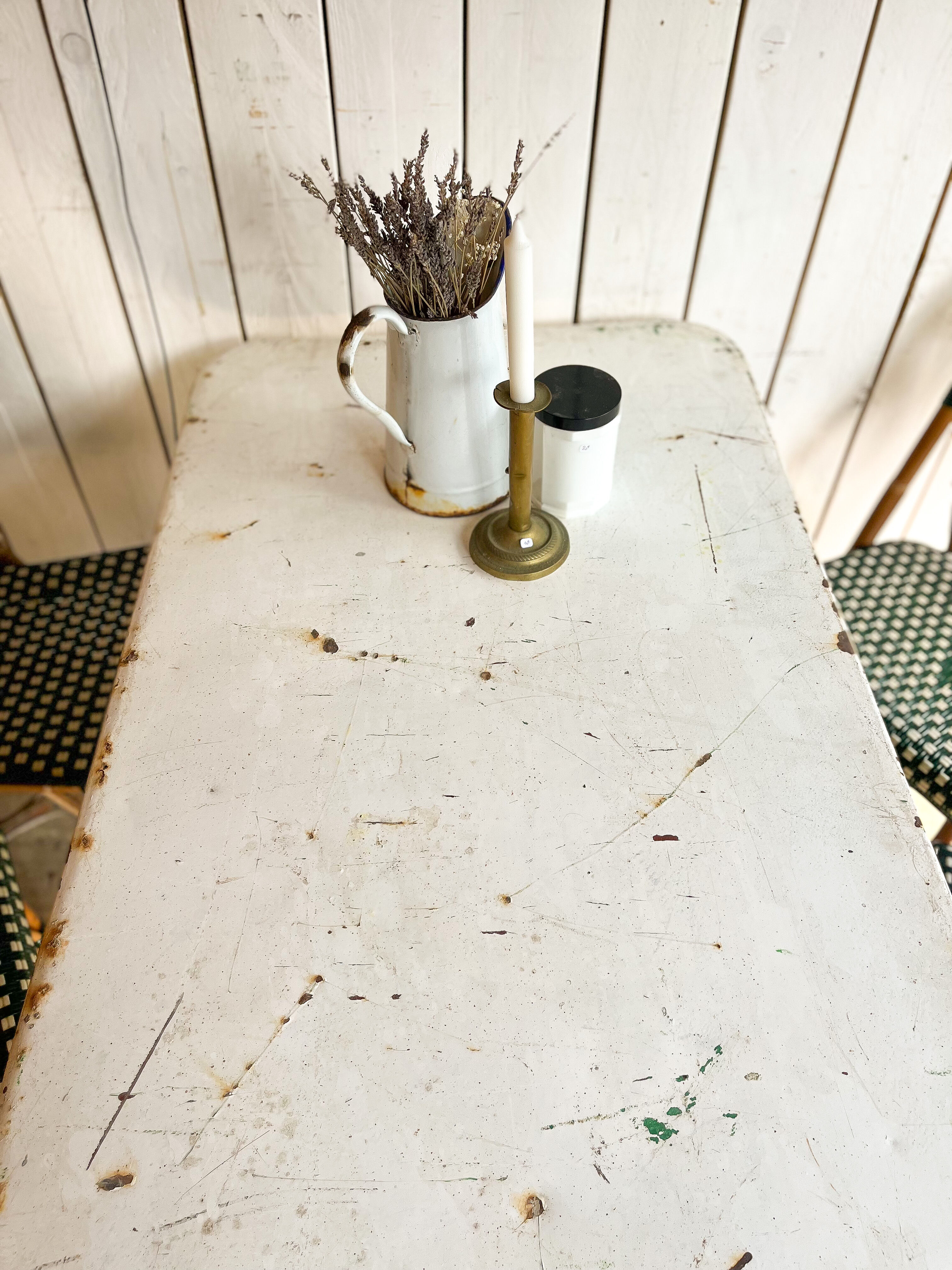 White folding metal bistro table