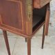 Old wooden bedside table on marble top