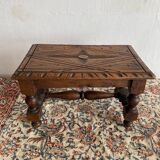 Low stool in carved wood