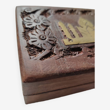 Old wooden box carved with flowers and brass