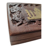 Old wooden box carved with flowers and brass