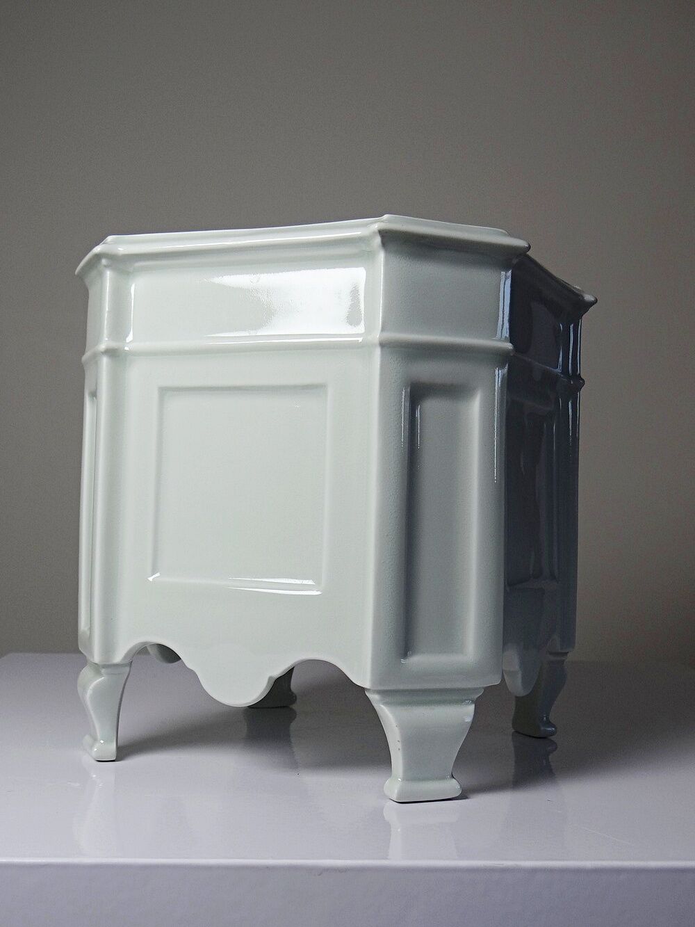 Square cache-pot with feet in celadon Limoges porcelain, Rococo style.
