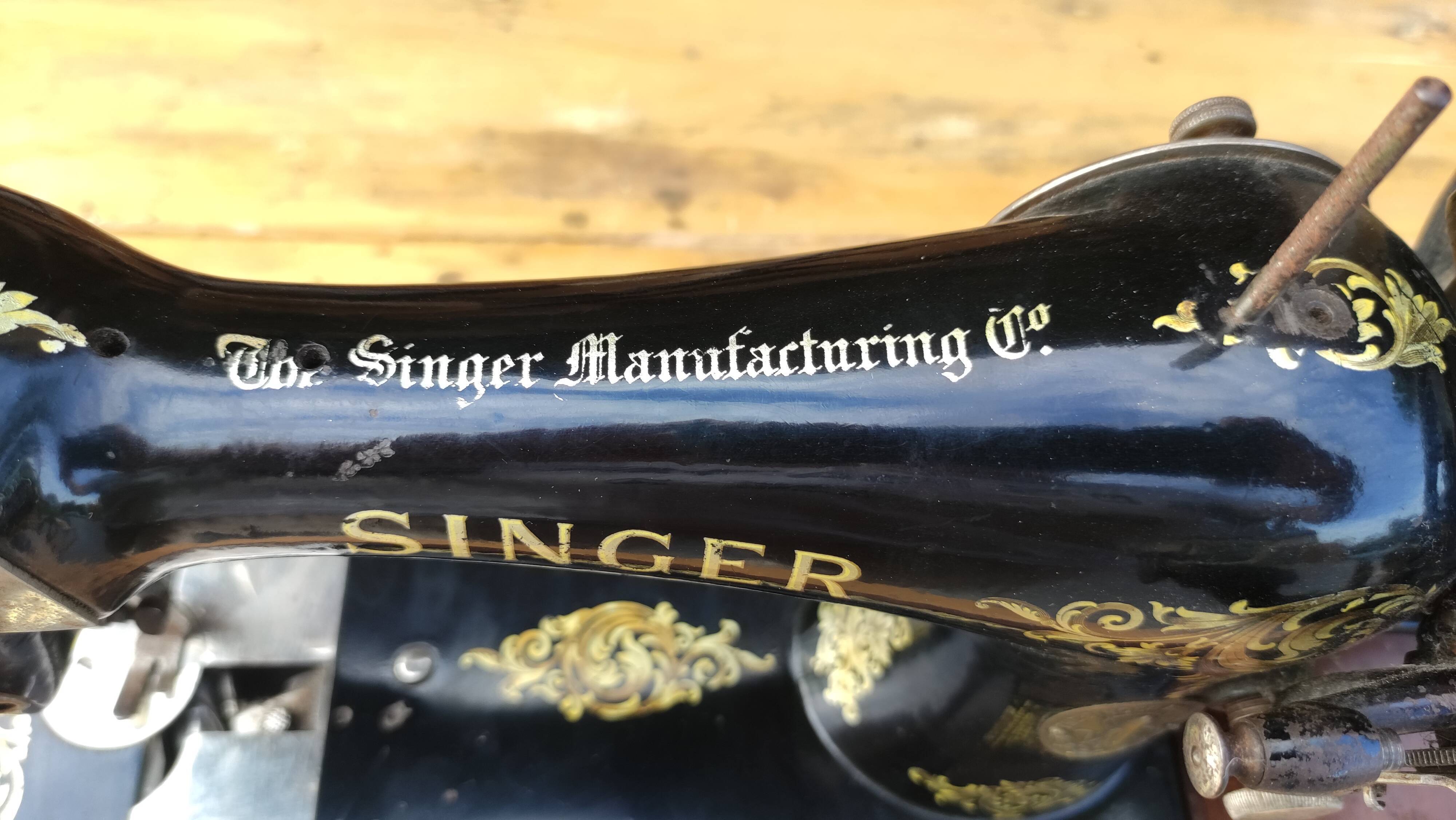 Old Singer sewing machine on its original base