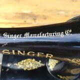 Old Singer sewing machine on its original base