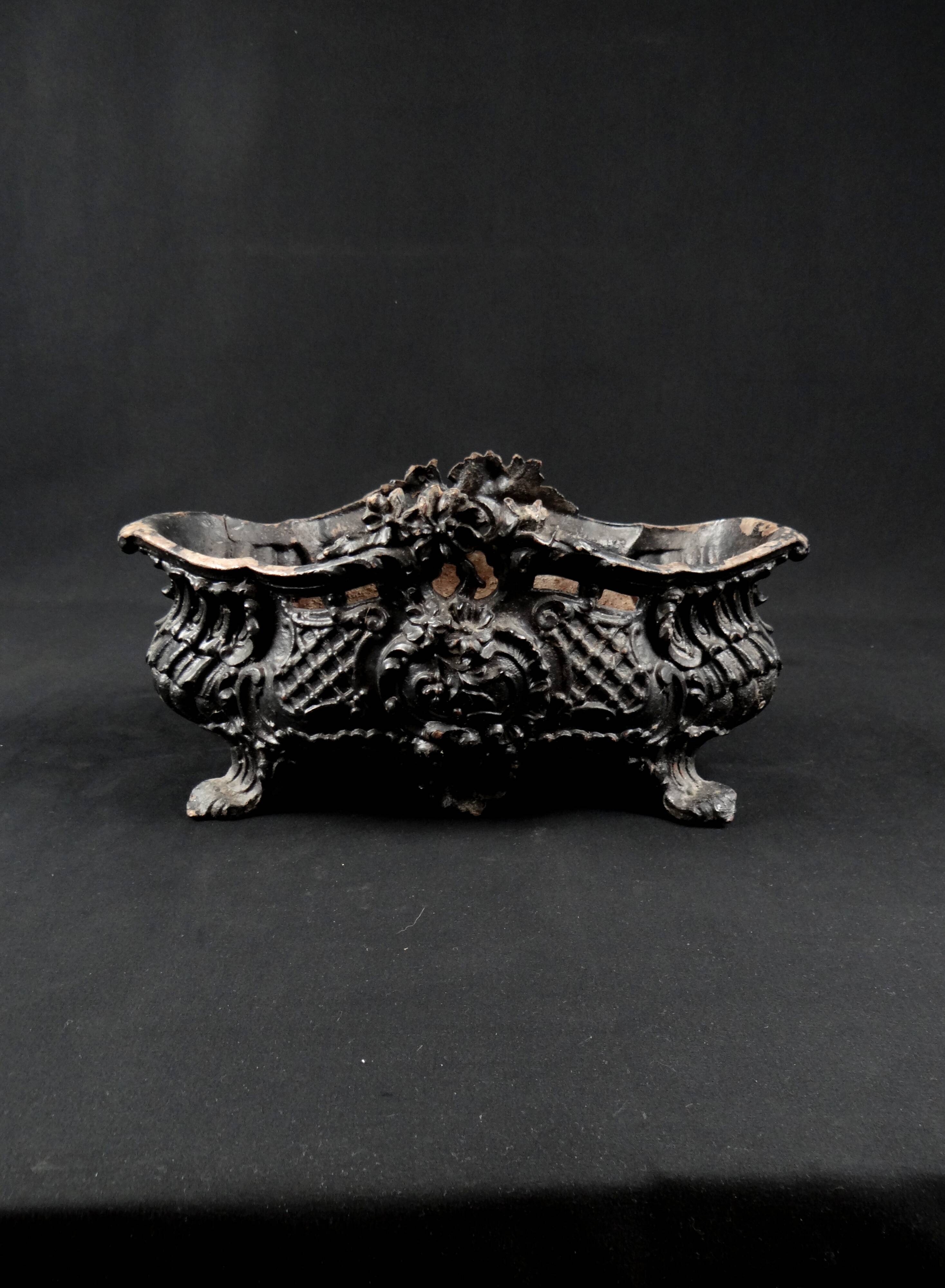 Antique black cast iron planter from the late 19th century Rocaille style