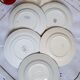 Antique dessert plates mismatched in earthenware with gilded edges