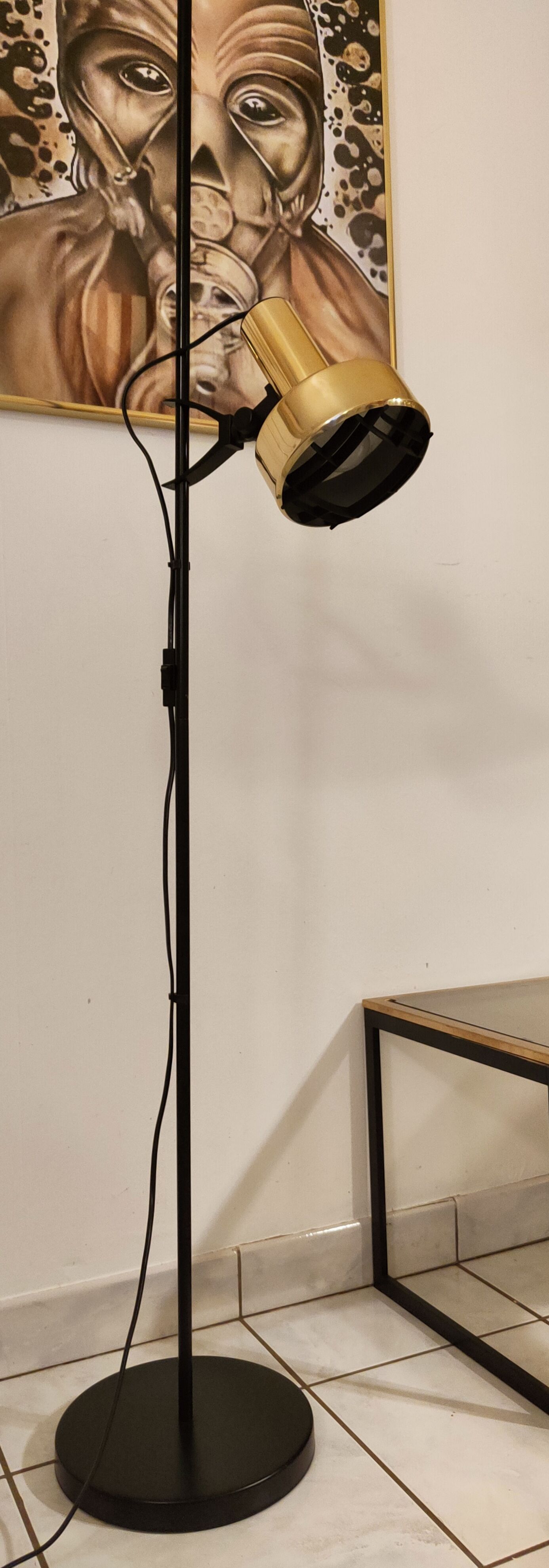 Black floor lamp is gold vintage 1980