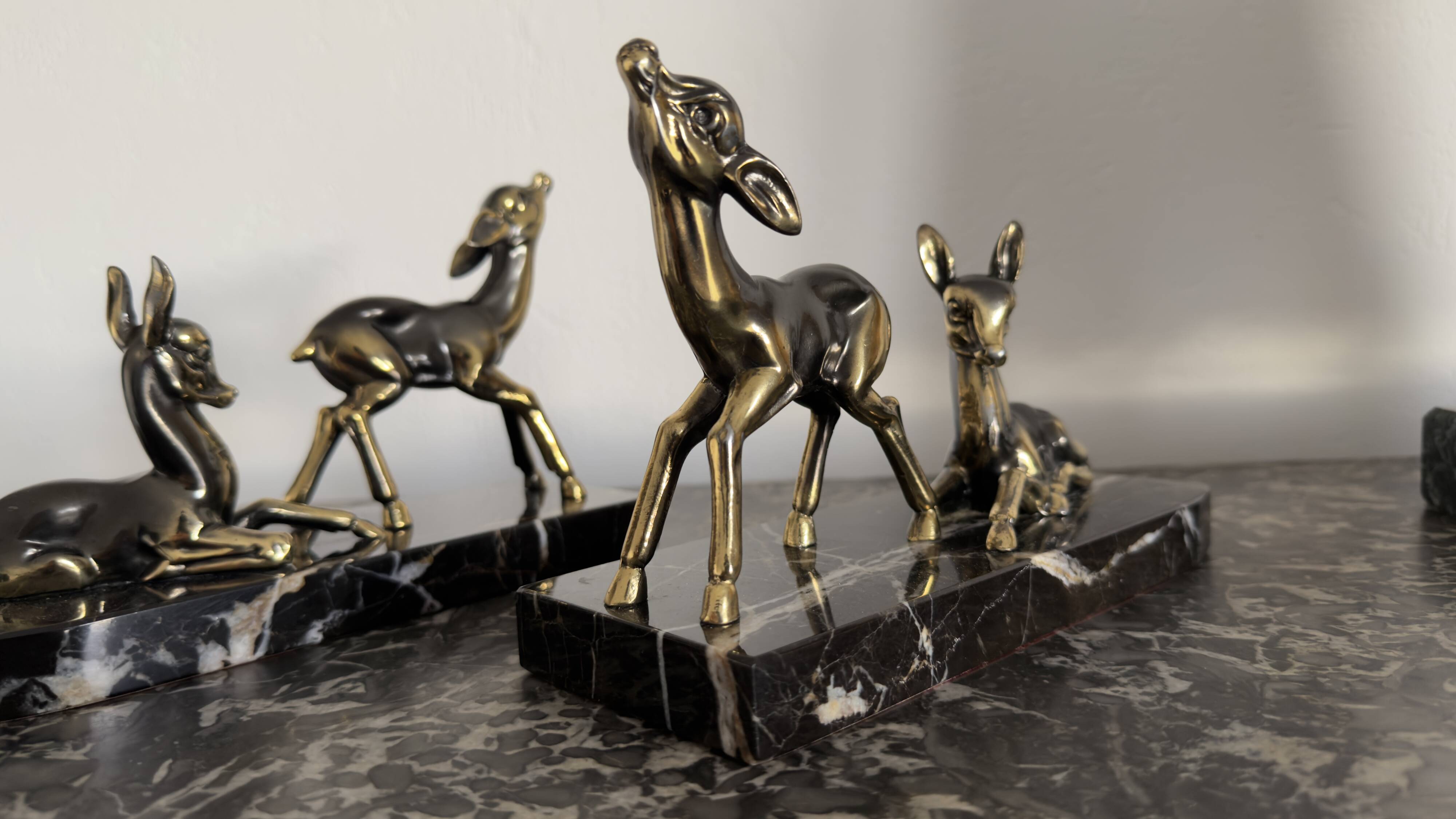 Art Deco bookends "Doe & Fawn" in black marble and gold metal