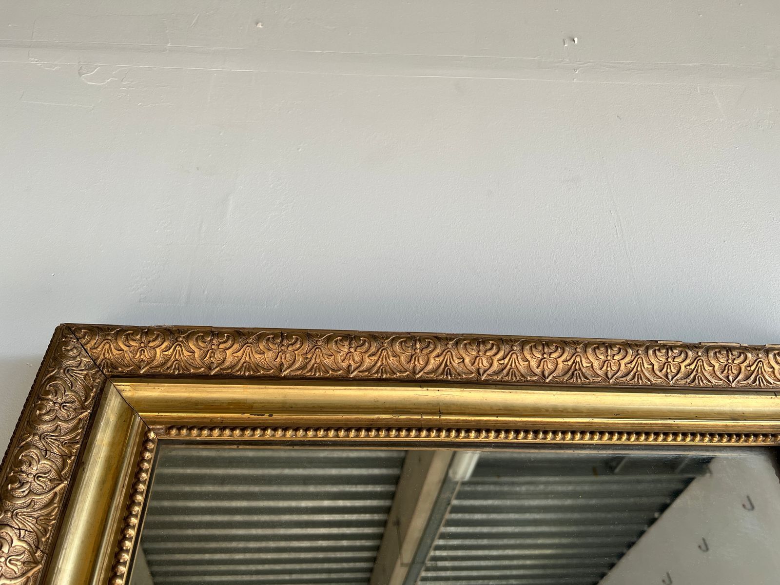 Gilded mirror with frieze h2m10 l:73cm