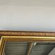 Gilded mirror with frieze h2m10 l:73cm