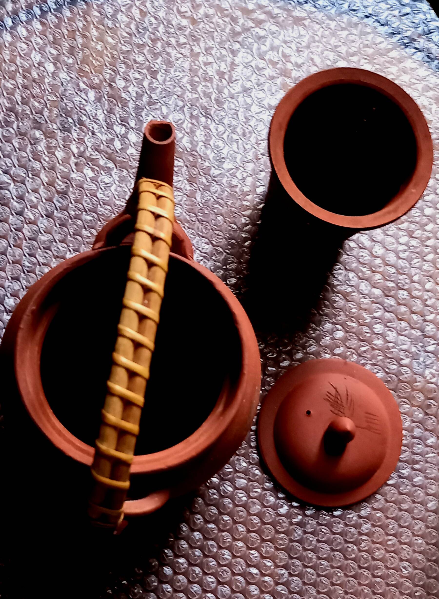 Terracotta and rattan teapot