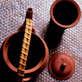 Terracotta and rattan teapot