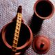 Terracotta and rattan teapot